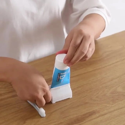 Squeeze & Stand: Mini Zahnpasta-Rollspender mit Halter
